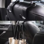 automobilio sėdynės organizatorius su papildomais kabliukais, ant kurių kabinamos tašes ir kiti daiktai